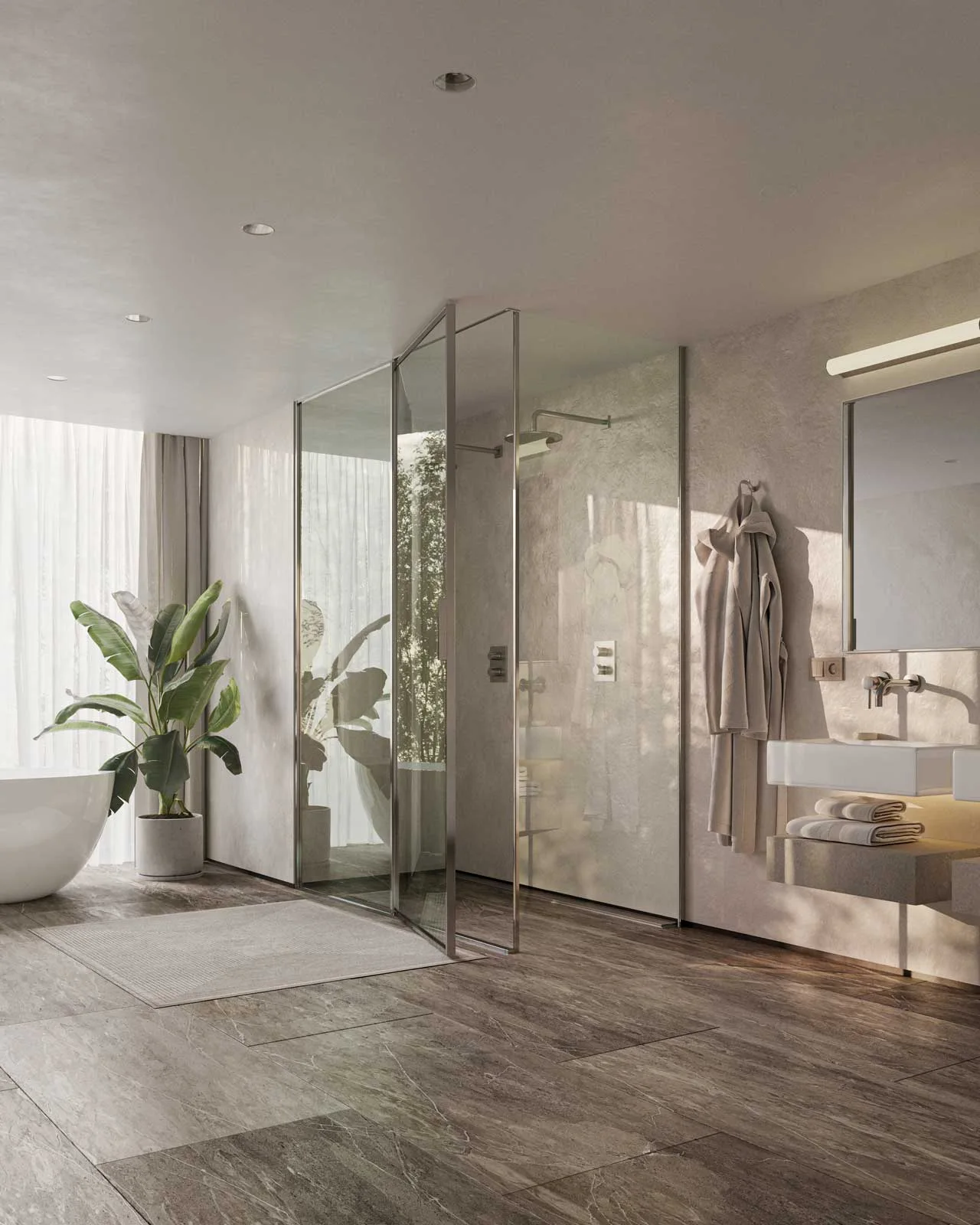 Tall curtains and a leafy plant beside a white bath, with light crossing a glass shower and a pale wall hung with bathrobes.