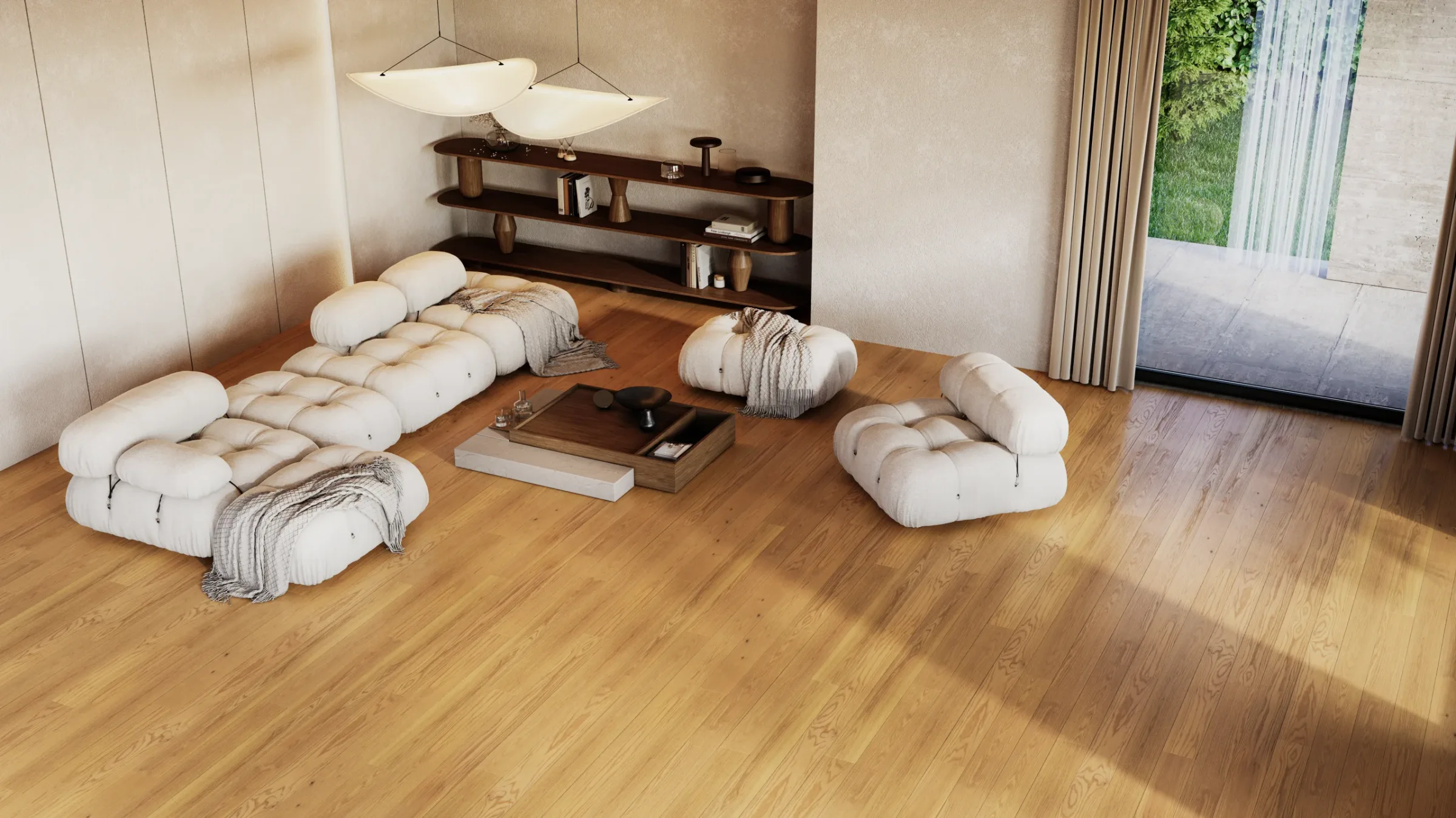 Golden floorboards with elongated grain surrounding white tufted seating and a low table, viewed from above at an angle.